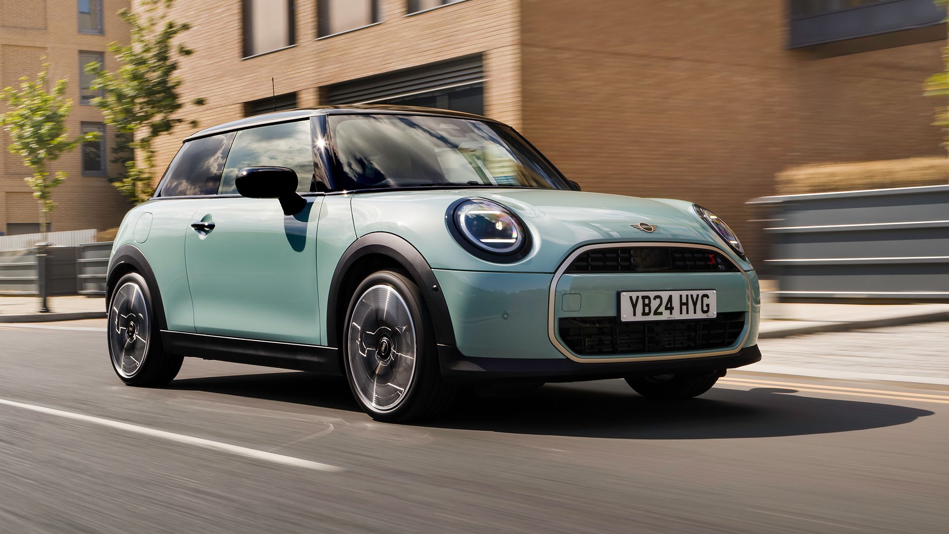 MINI Cooper driving down the road 